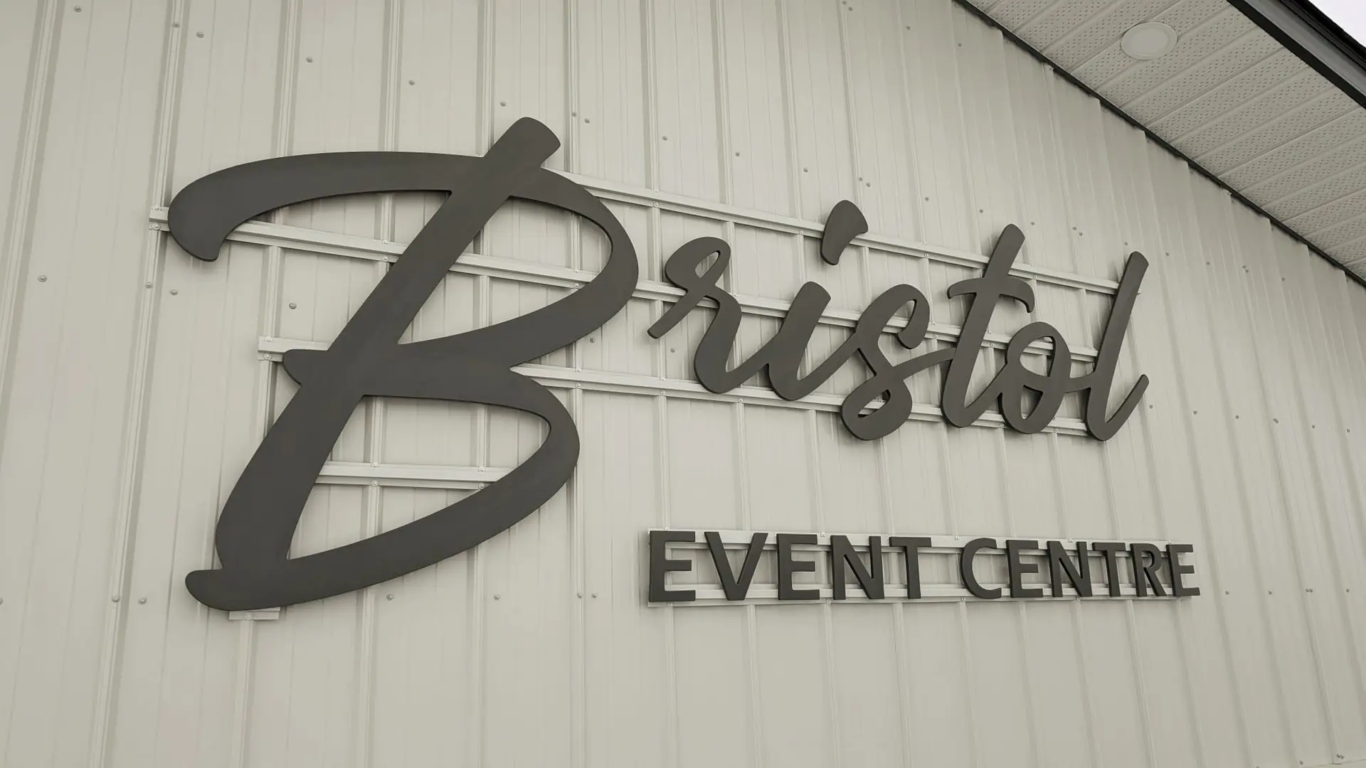 The exterior of Bristol Event Centre in winter, with the parking lot off the road